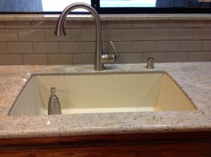 After: Composite Sink, Stainless Steel Faucet and gleaming glass tile
