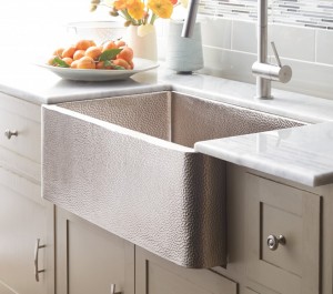 Apron Front Sinks can be porcelain, stone, stainless steel, copper or nickel as shown here